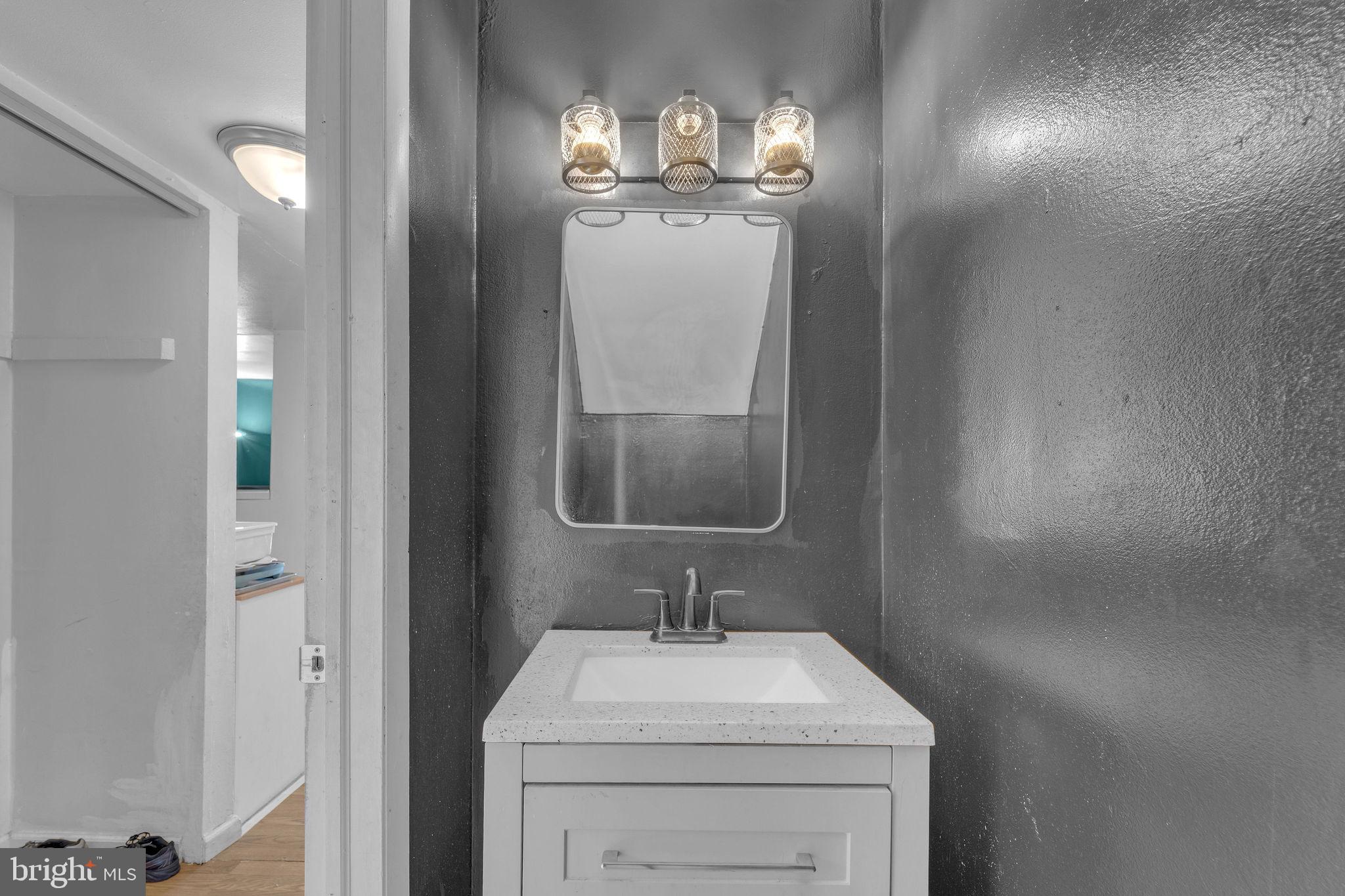 733 Myrtle Avenue Lindenwold, NJ 08021 - Photo 7 of 29 Sleek modern bathroom with stylish lighting.