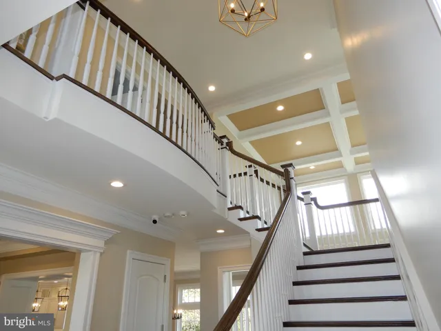 a view of a dining room with furniture wooden floor and a chandelier