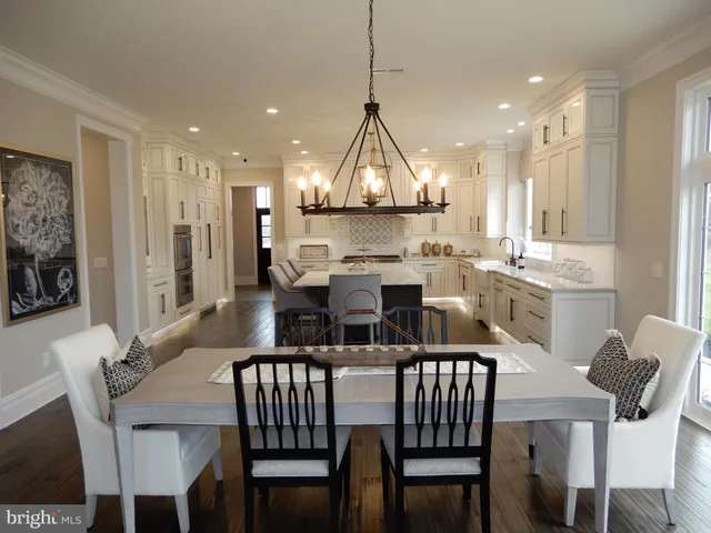 a view of a sink and dishwasher with wooden floor