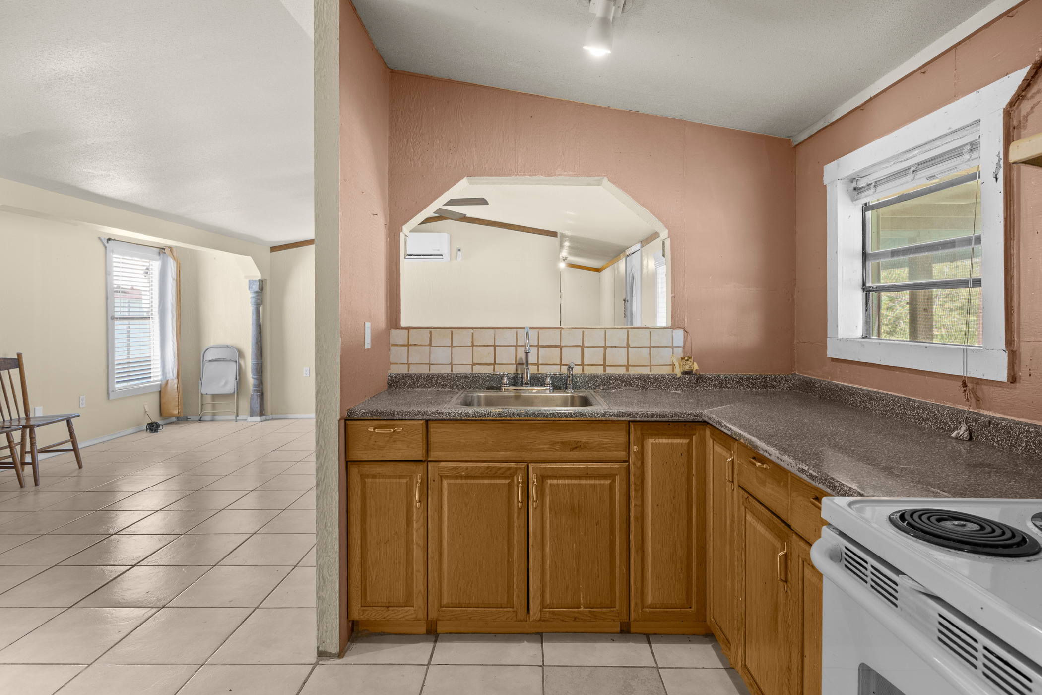 147 Community Center Road Rosanky, TX 78953 - Photo 11 of 33 a kitchen with a sink and cabinets