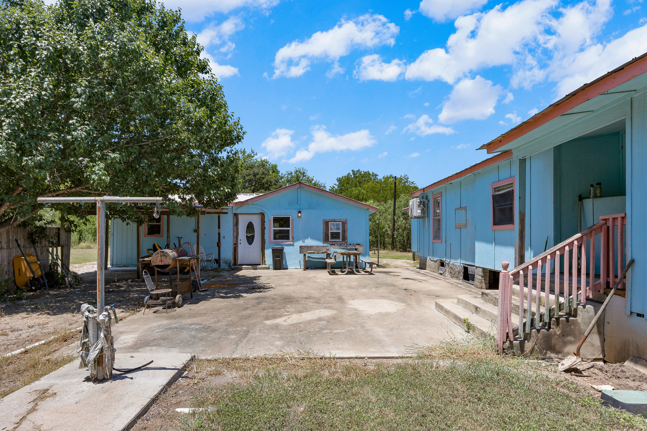 147 Community Center Road Rosanky, TX 78953 - Photo 21 of 33 a view of a house with a patio