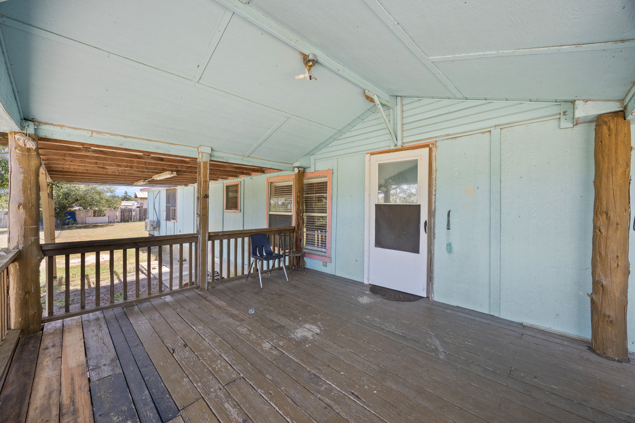 147 Community Center Road Rosanky, TX 78953 - Photo 5 of 33 a view of a porch with wooden floor and outdoor space