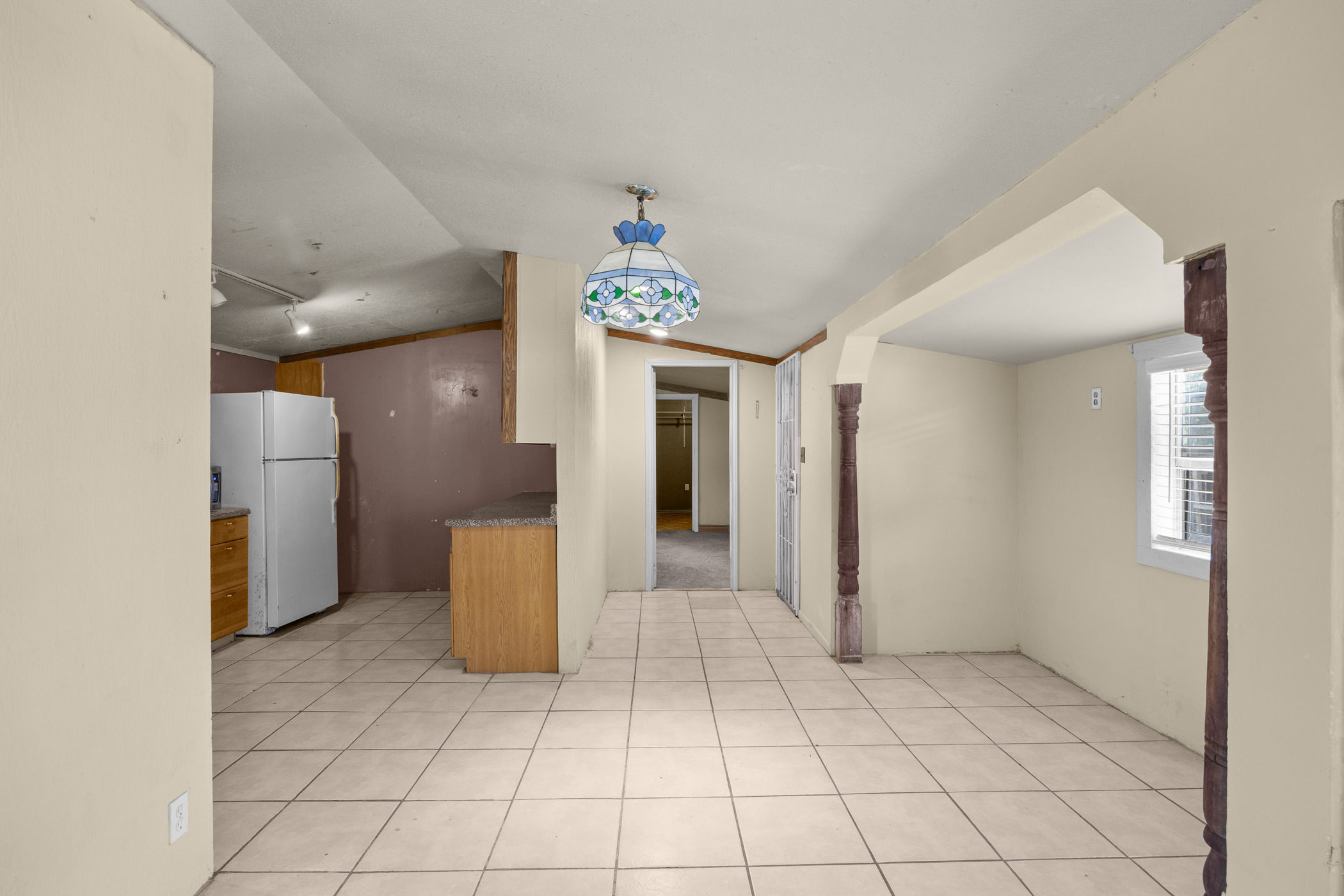 147 Community Center Road Rosanky, TX 78953 - Photo 8 of 33 a view of a kitchen with a sink and a chandelier