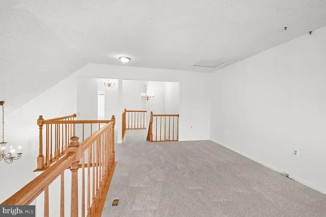 a view of a hallway with staircase