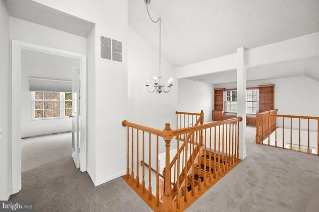 a view of a hallway with windows