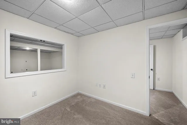 a view of a balcony with wooden floor and fence