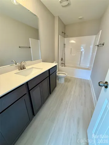 a view of a big room with an entryway