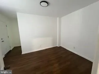 an empty room with wooden floor