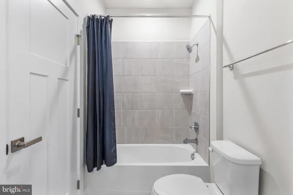 a bathroom with double vanity sinks and a mirror