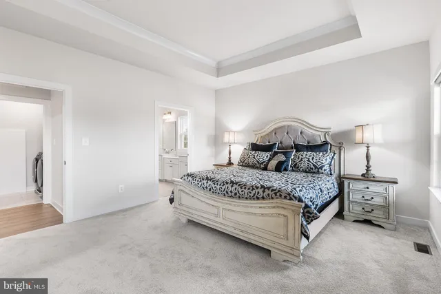 a aerial view of a house next to a yard