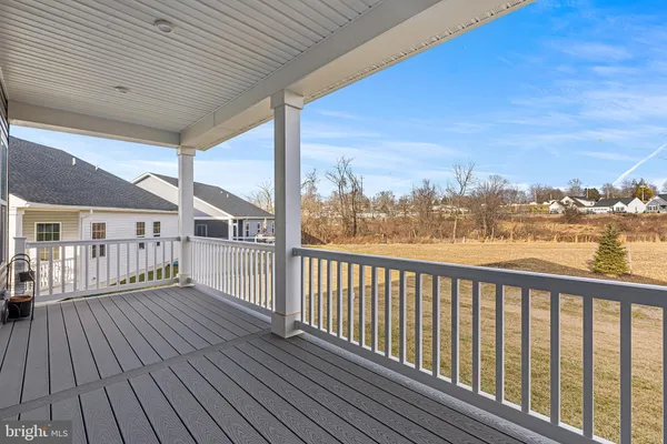 a view of a balcony with wooden floor