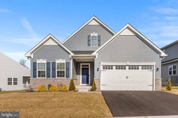a front view of a house with a outdoor space