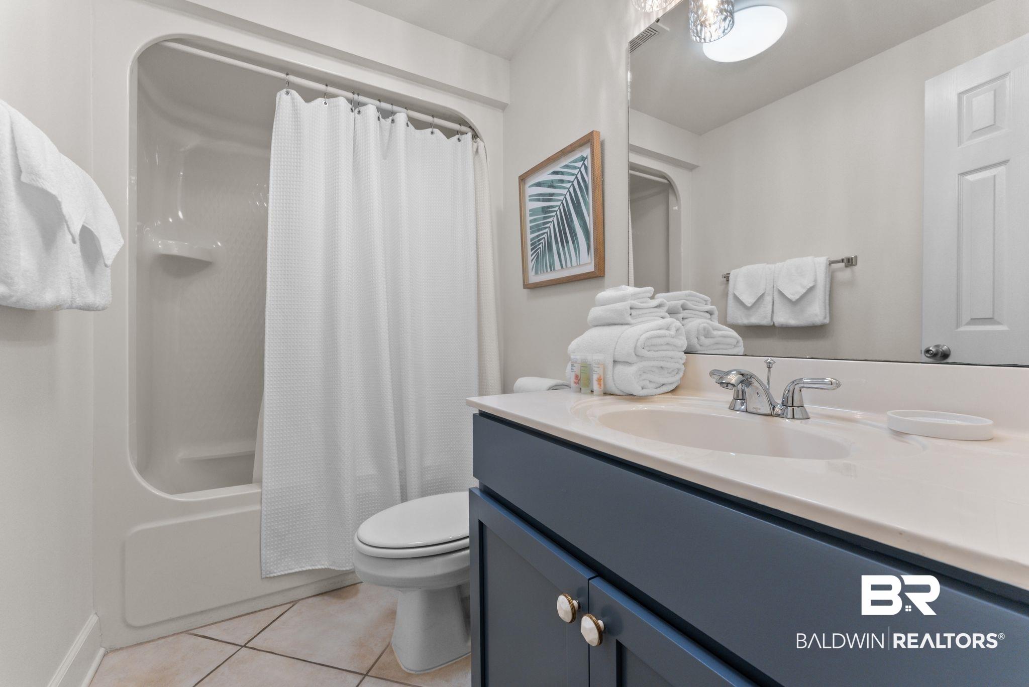 27580 Canal Road, Unit 1233 Orange Beach, AL 36561 - Photo 8 of 79 Full bath featuring vanity, shower / bathtub combination with curtain, and light tile patterned floors