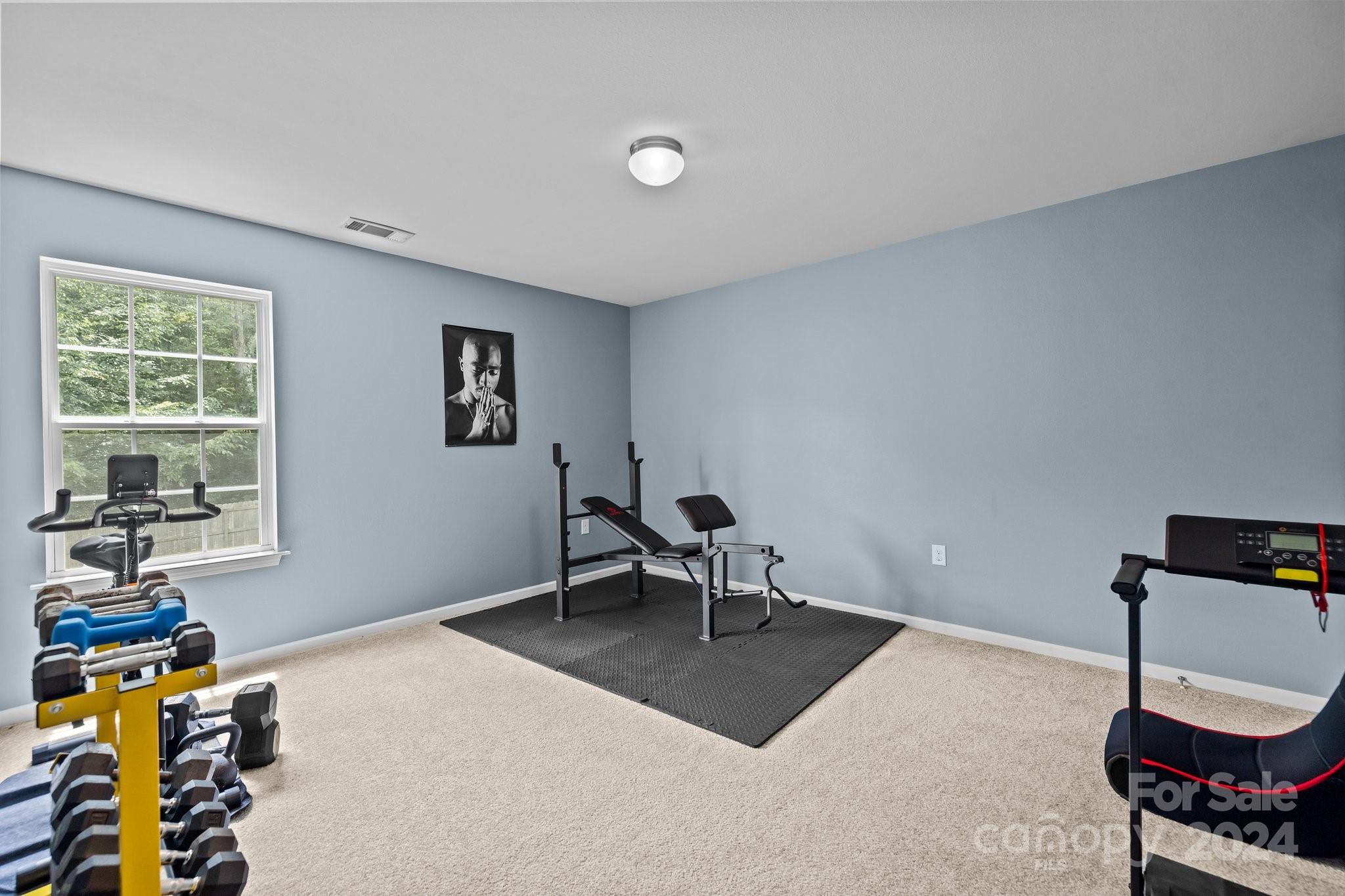 5511 Keener Ridge Road Charlotte, NC 28216 - Photo 15 of 31 a living room with furniture a window and a flat screen tv