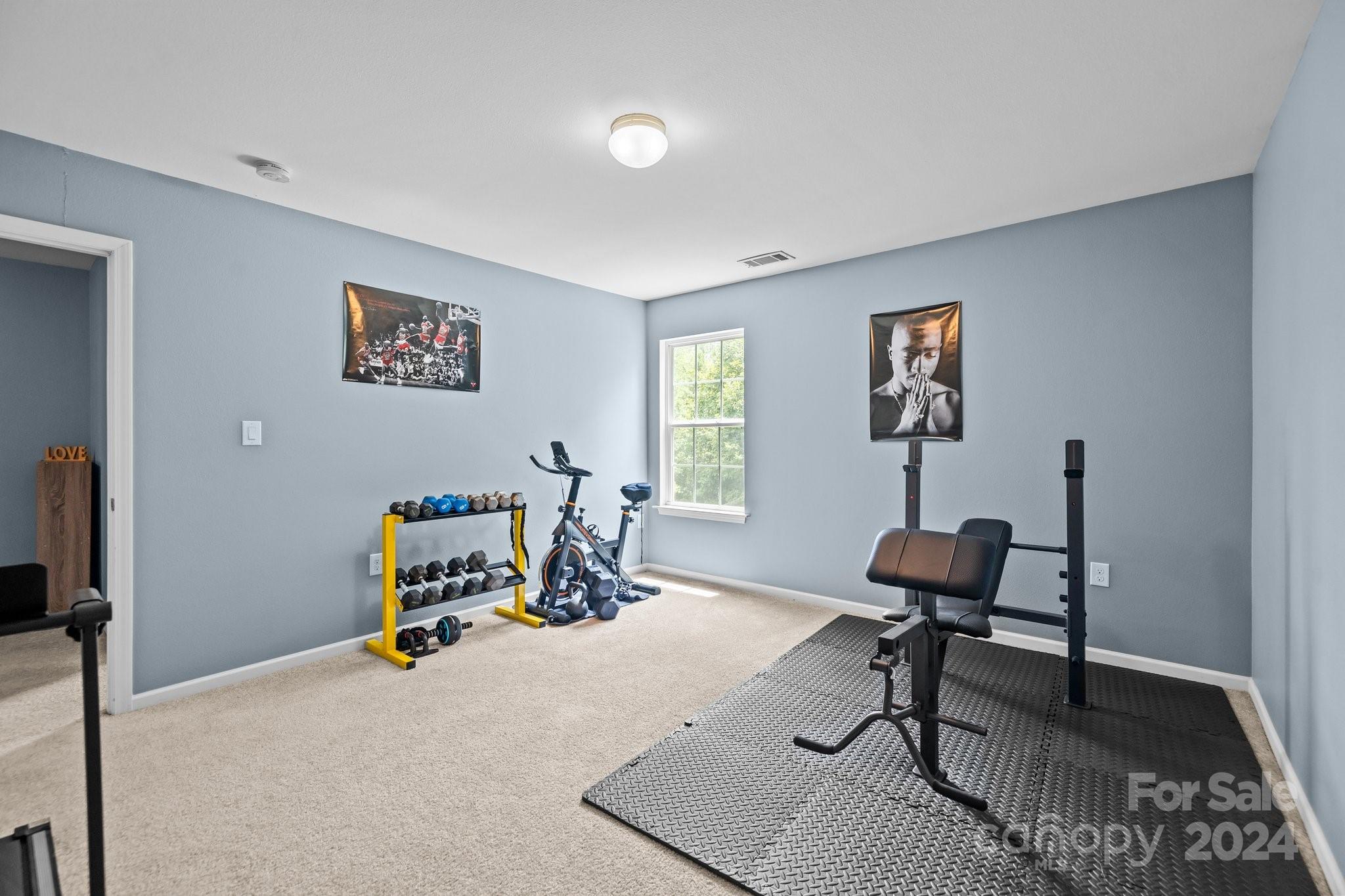 5511 Keener Ridge Road Charlotte, NC 28216 - Photo 16 of 31 a view of a workspace with furniture and a window
