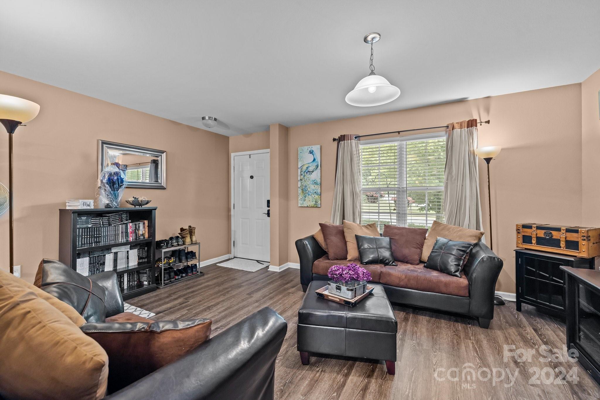 5511 Keener Ridge Road Charlotte, NC 28216 - Photo 18 of 31 a living room with furniture and a large window