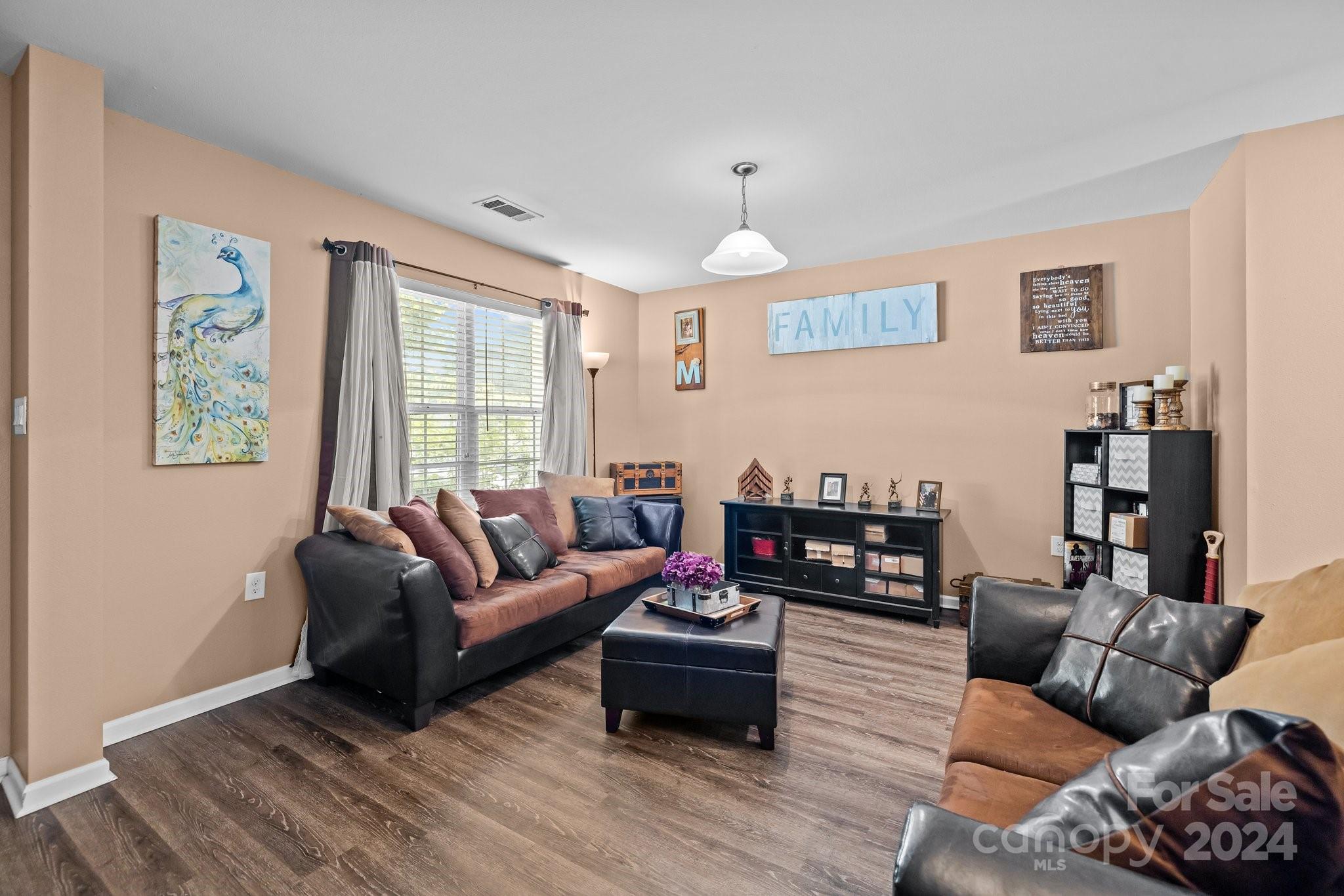 5511 Keener Ridge Road Charlotte, NC 28216 - Photo 19 of 31 a living room with furniture window and wooden floor