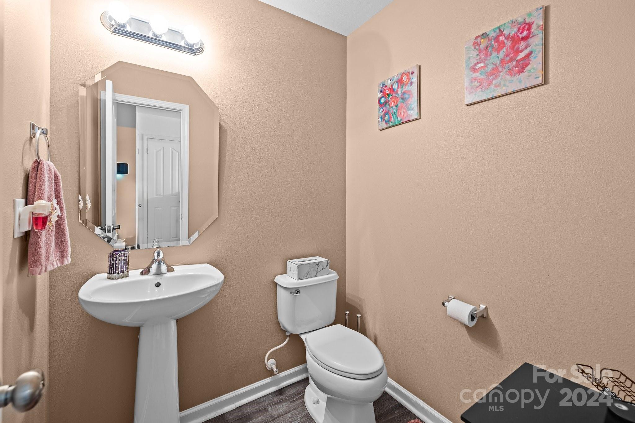 5511 Keener Ridge Road Charlotte, NC 28216 - Photo 21 of 31 a bathroom with a sink mirror and toilet