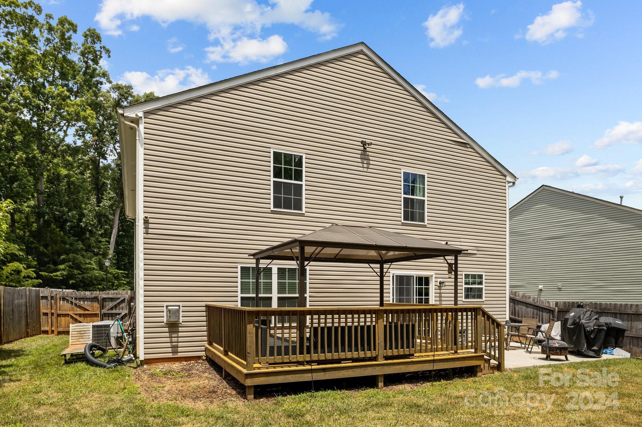 5511 Keener Ridge Road Charlotte, NC 28216 - Photo 27 of 31 a view of a house with a yard and deck area