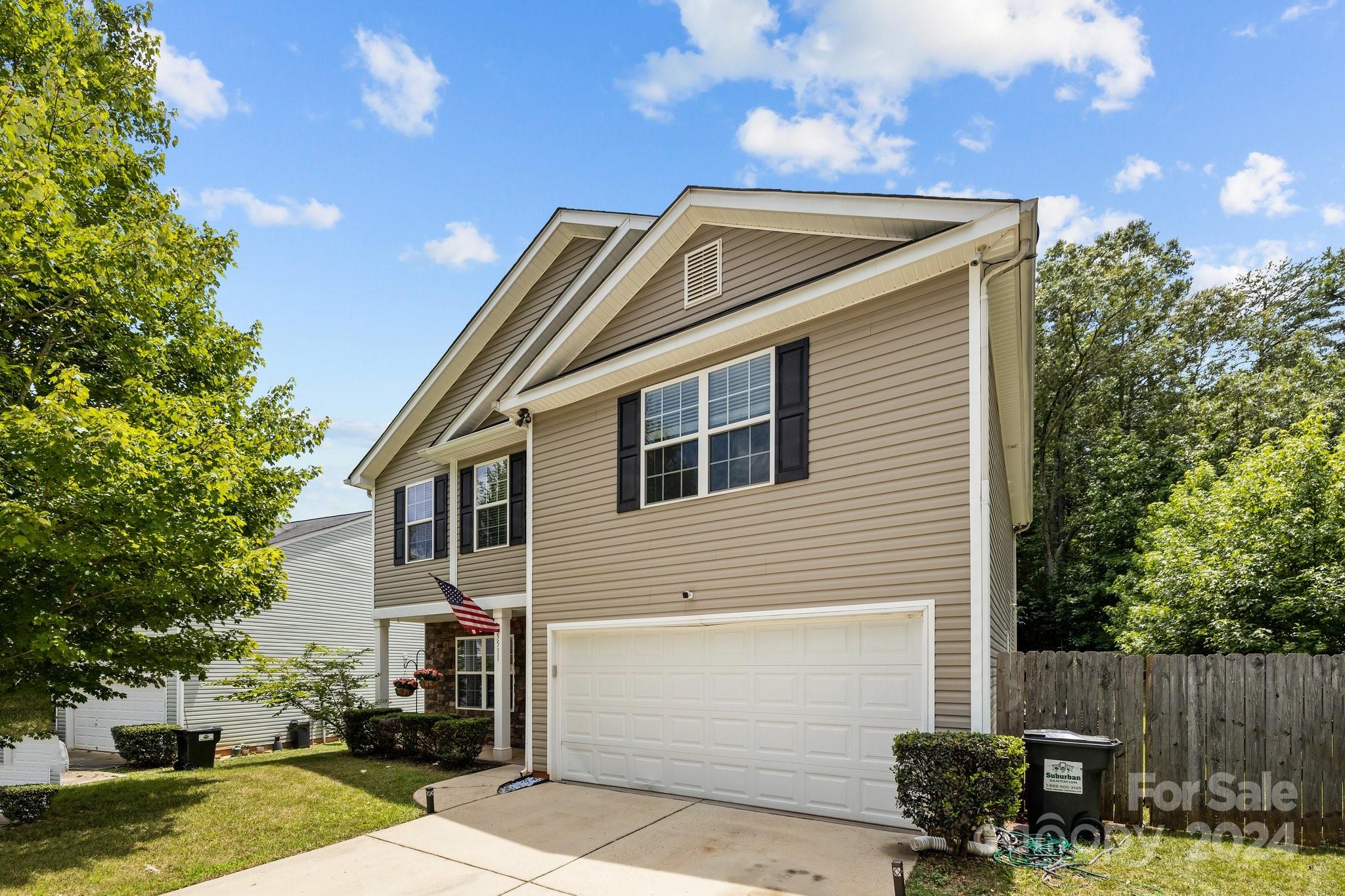 5511 Keener Ridge Road Charlotte, NC 28216 - Photo 31 of 31 a back view of a house with a yard
