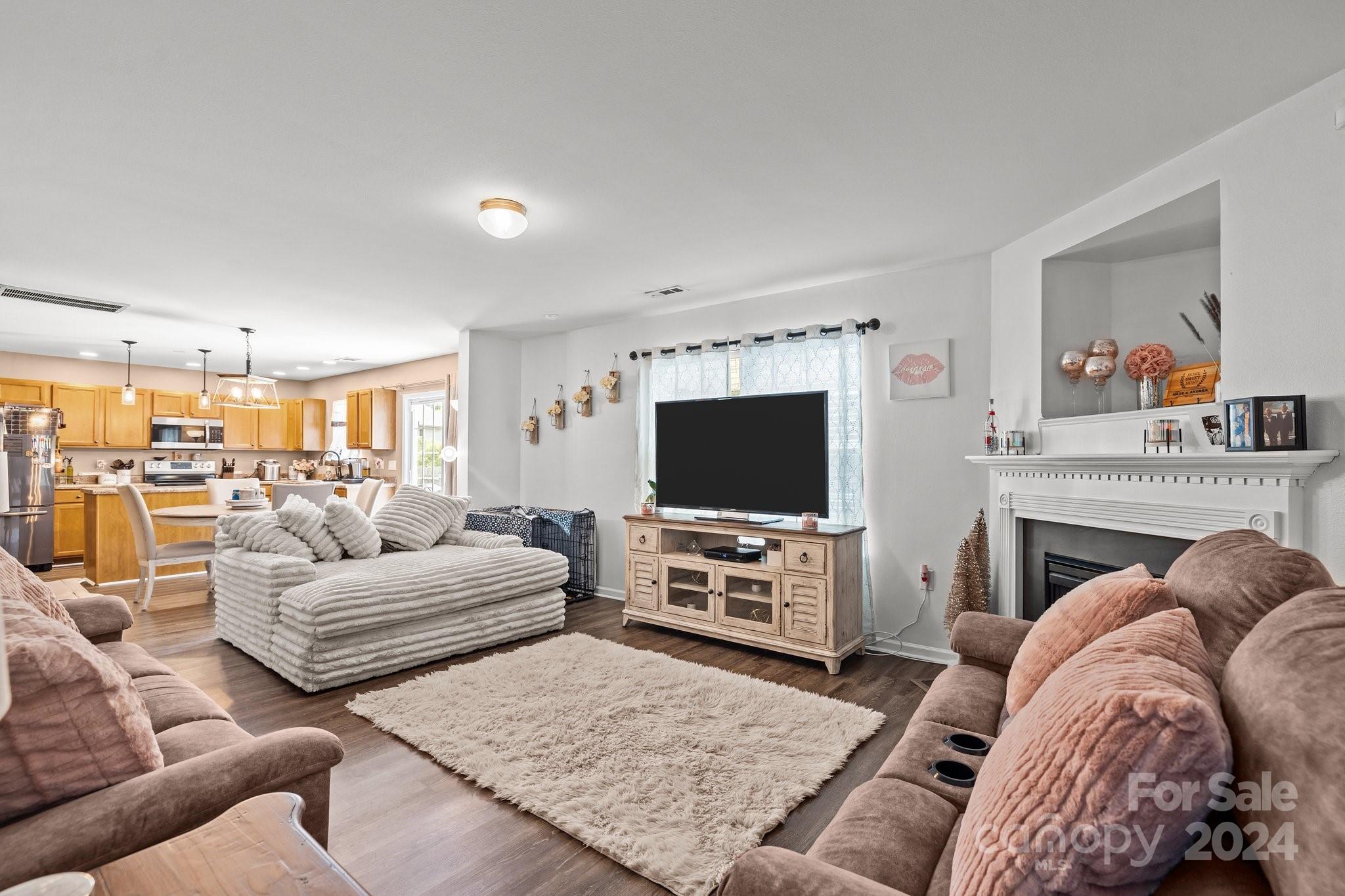 5511 Keener Ridge Road Charlotte, NC 28216 - Photo 8 of 31 a living room with furniture and a flat screen tv