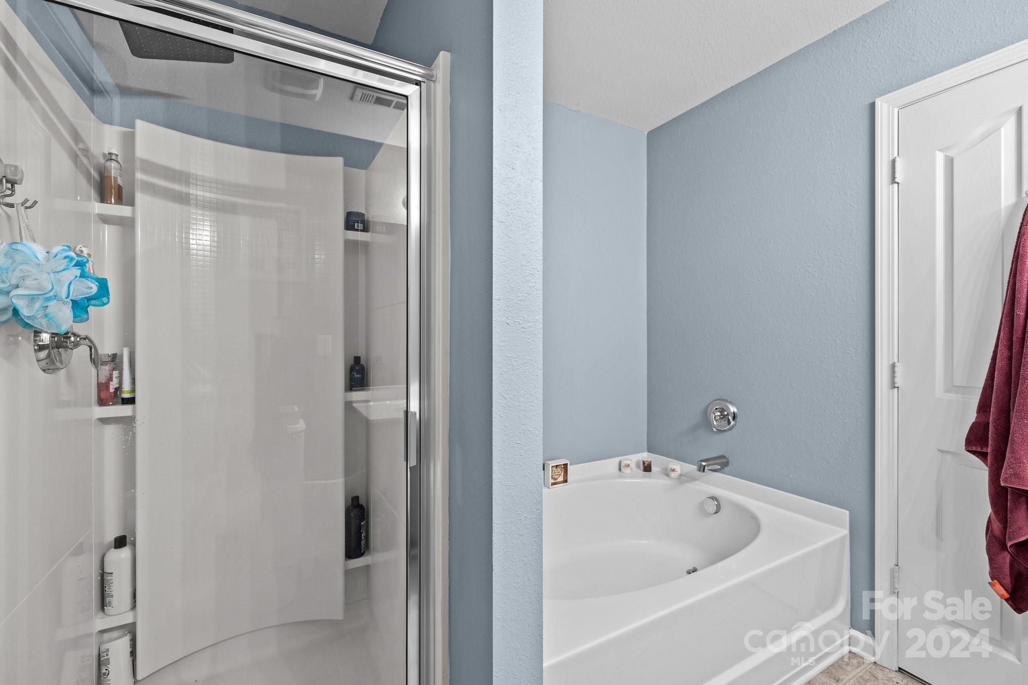 5511 Keener Ridge Road Charlotte, NC 28216 - Photo 9 of 31 a bathroom with a tub and shower