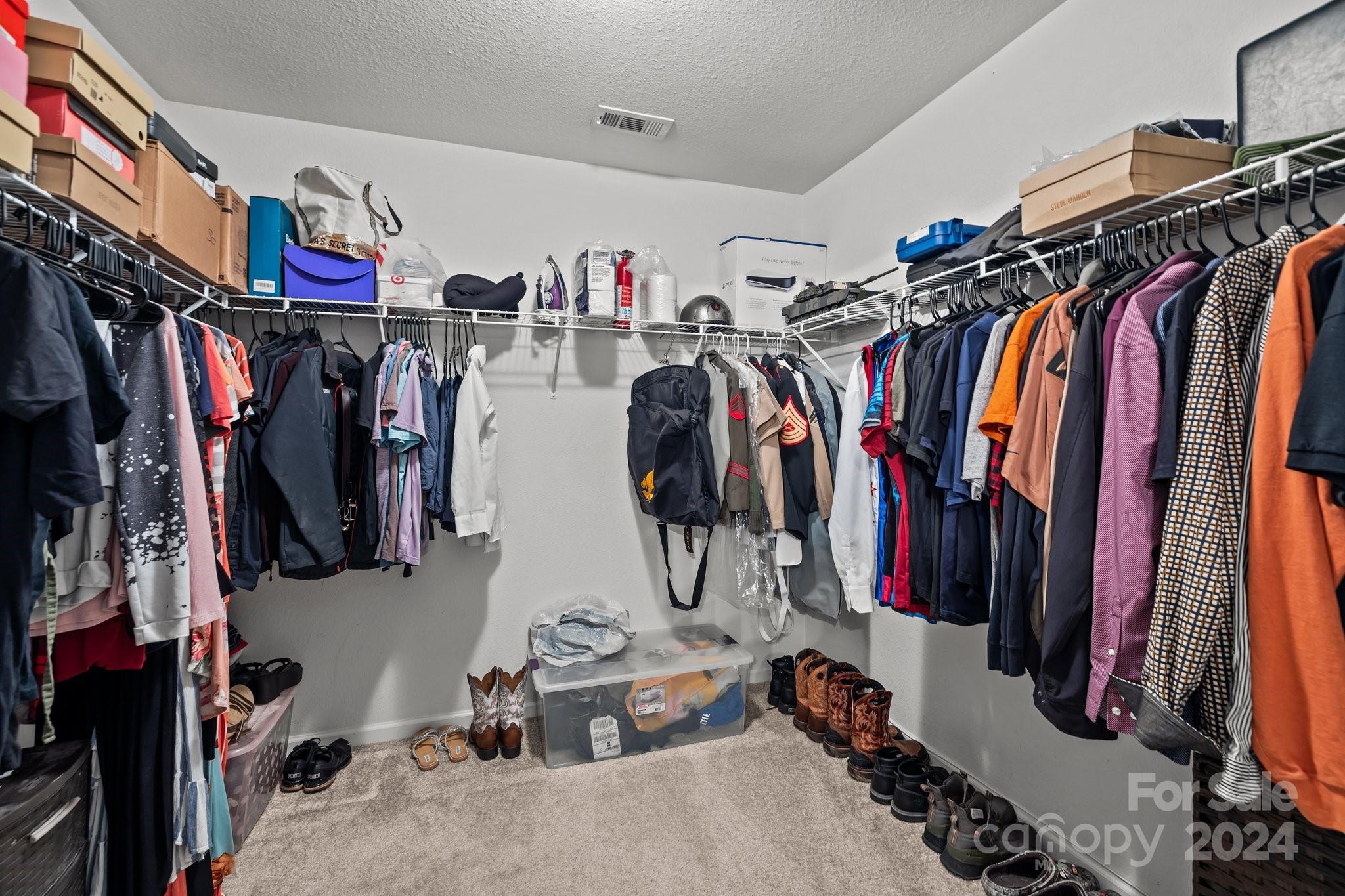 5511 Keener Ridge Road Charlotte, NC 28216 - Photo 10 of 31 a view of walk in closet with clothes