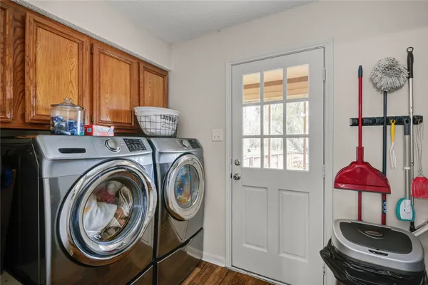 a view of a bedroom with washer and dryer