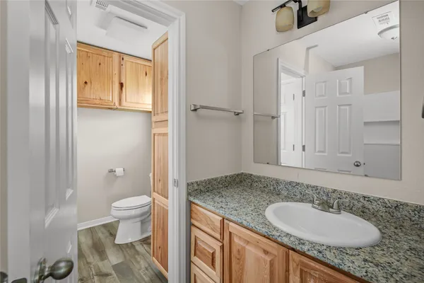 a bathroom with a bathtub and a toilet