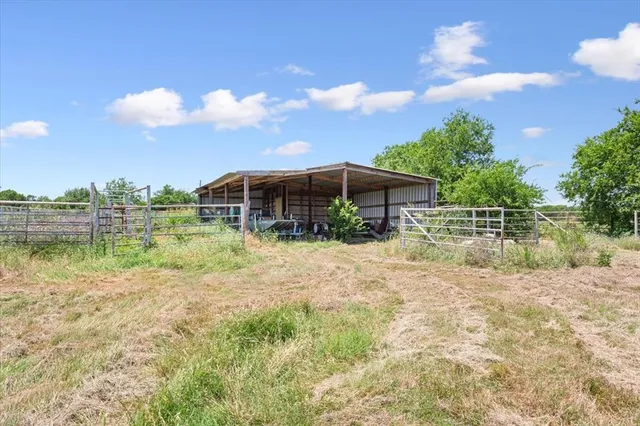 a view of a lake with a house in the background