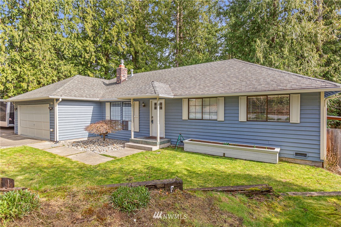 804 Duchess Road Bothell, WA 98012 - Photo 1 of 37 a backyard of a house with table and chairs