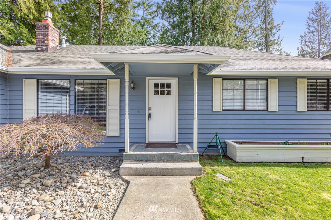 804 Duchess Road Bothell, WA 98012 - Photo 2 of 37 a front view of a house with garden