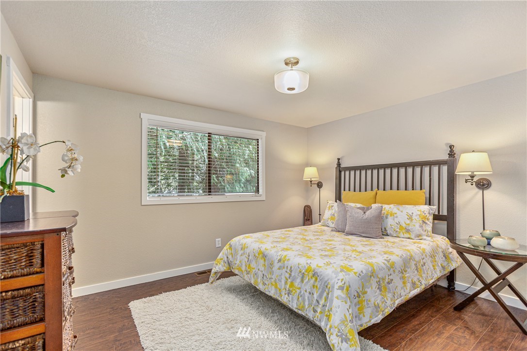 804 Duchess Road Bothell, WA 98012 - Photo 13 of 37 a bedroom with a bed and a window