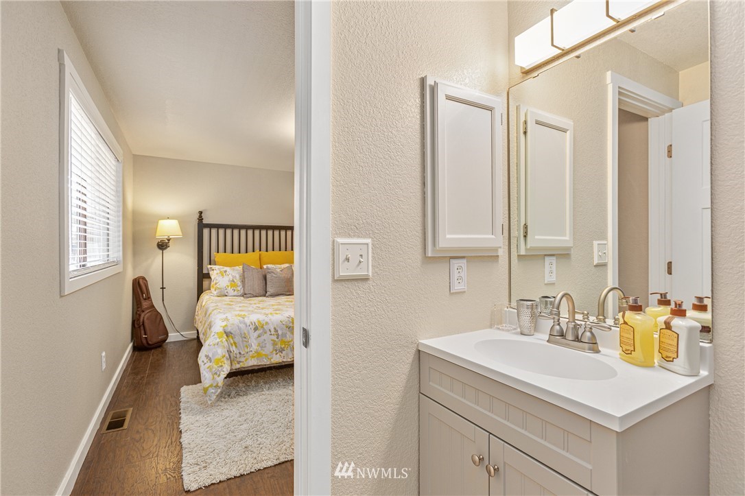 804 Duchess Road Bothell, WA 98012 - Photo 15 of 37 a en suite bathroom with a sink and a mirror