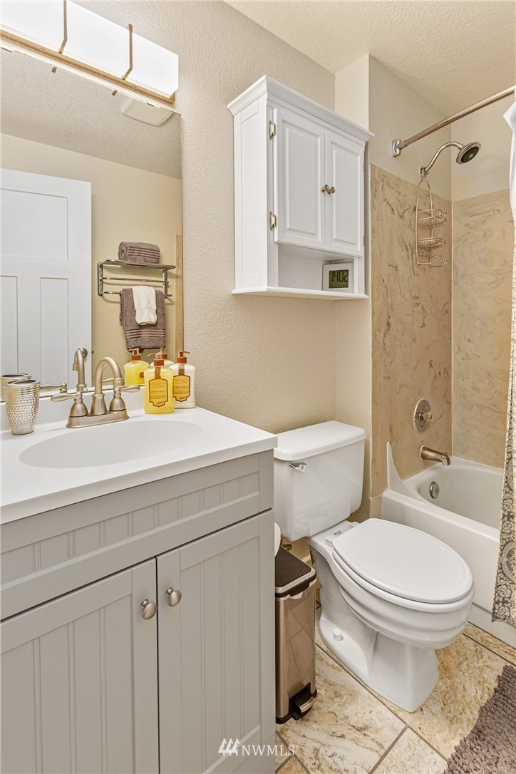 804 Duchess Road Bothell, WA 98012 - Photo 16 of 37 a bathroom with a sink a toilet and shower