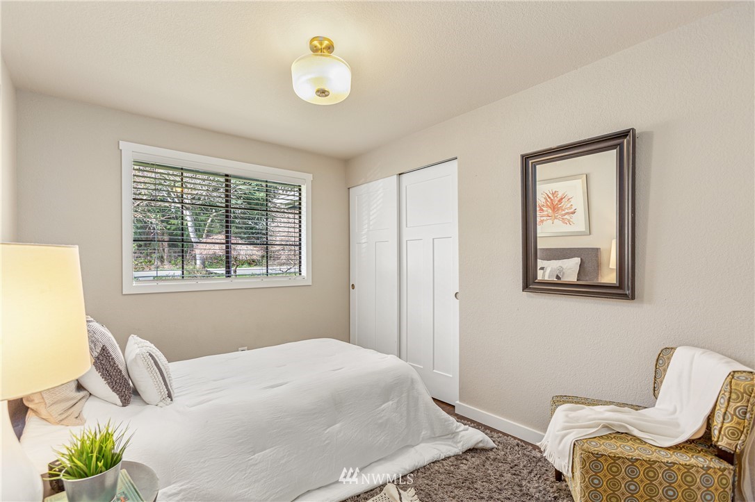 804 Duchess Road Bothell, WA 98012 - Photo 18 of 37 a bedroom with a bed and chair