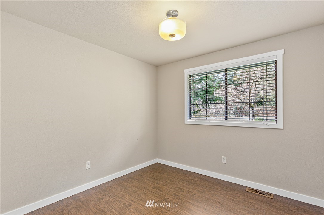 804 Duchess Road Bothell, WA 98012 - Photo 19 of 37 an empty room with windows