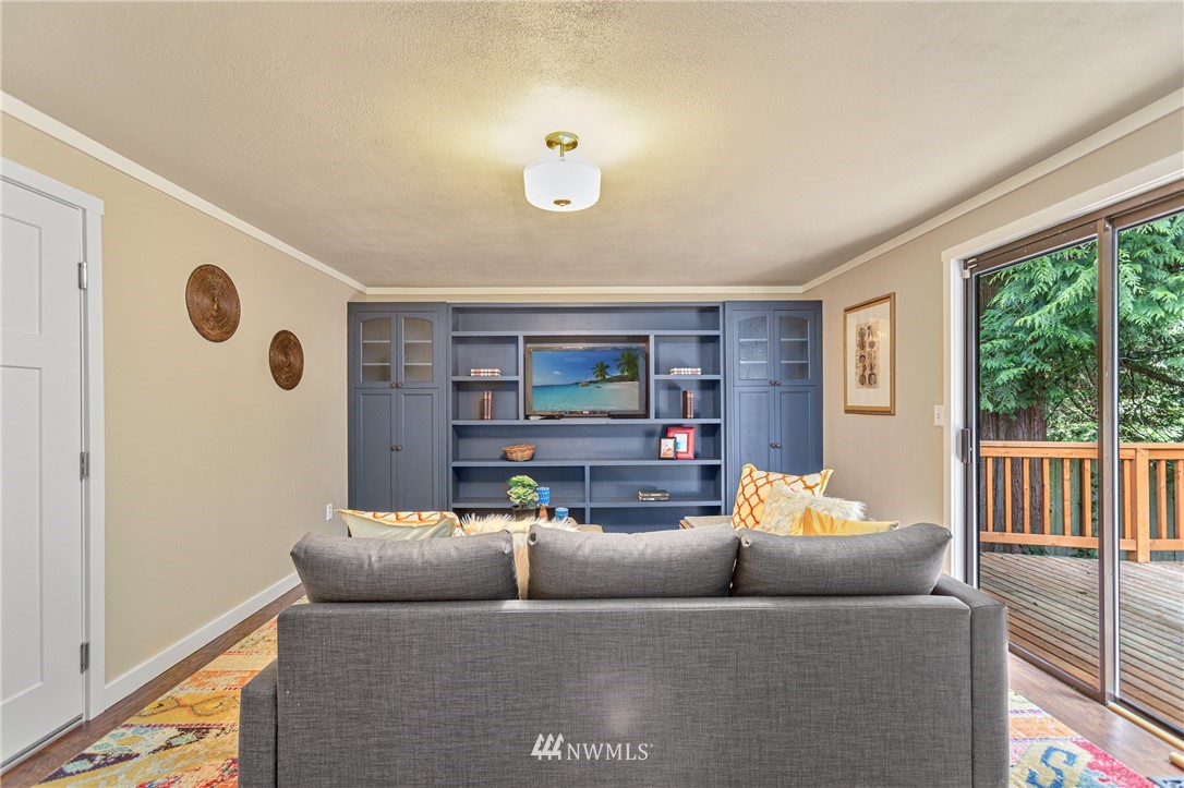 804 Duchess Road Bothell, WA 98012 - Photo 23 of 37 a living room with furniture and a large window