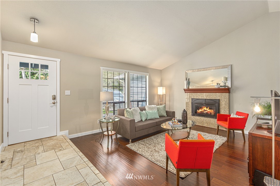 804 Duchess Road Bothell, WA 98012 - Photo 4 of 37 a living room with furniture and a fireplace