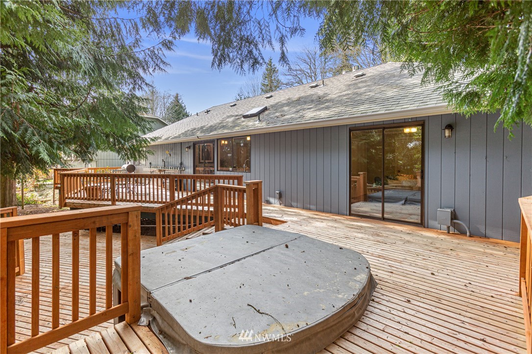 804 Duchess Road Bothell, WA 98012 - Photo 31 of 37 a view of a house with wooden deck and a backyard