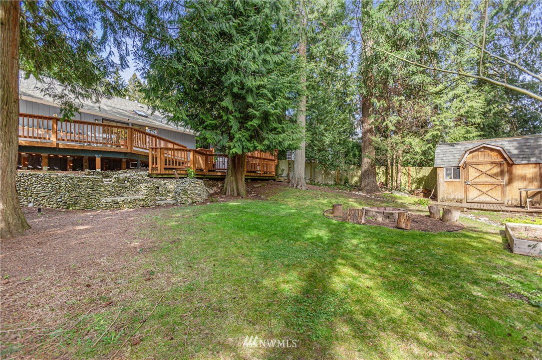 804 Duchess Road Bothell, WA 98012 - Photo 35 of 37 a backyard of a house with table and chairs