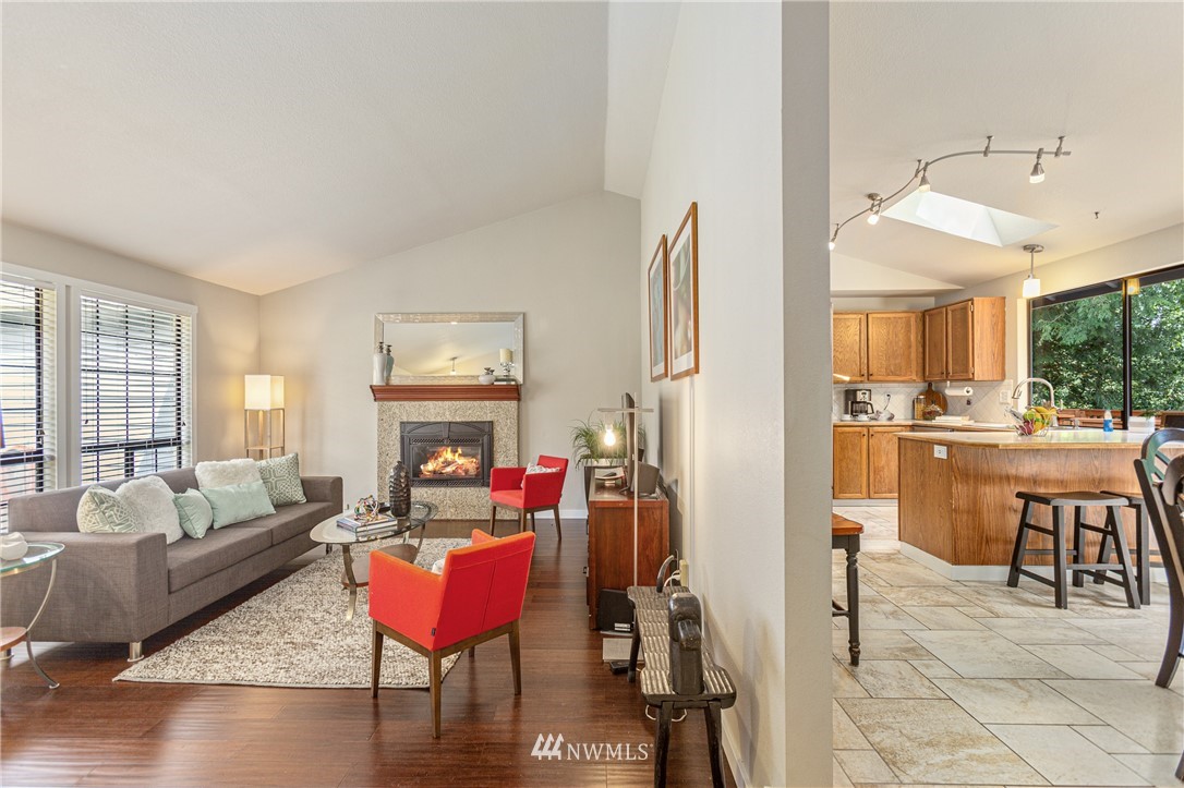 804 Duchess Road Bothell, WA 98012 - Photo 5 of 37 a living room with furniture a wooden floor and a large window