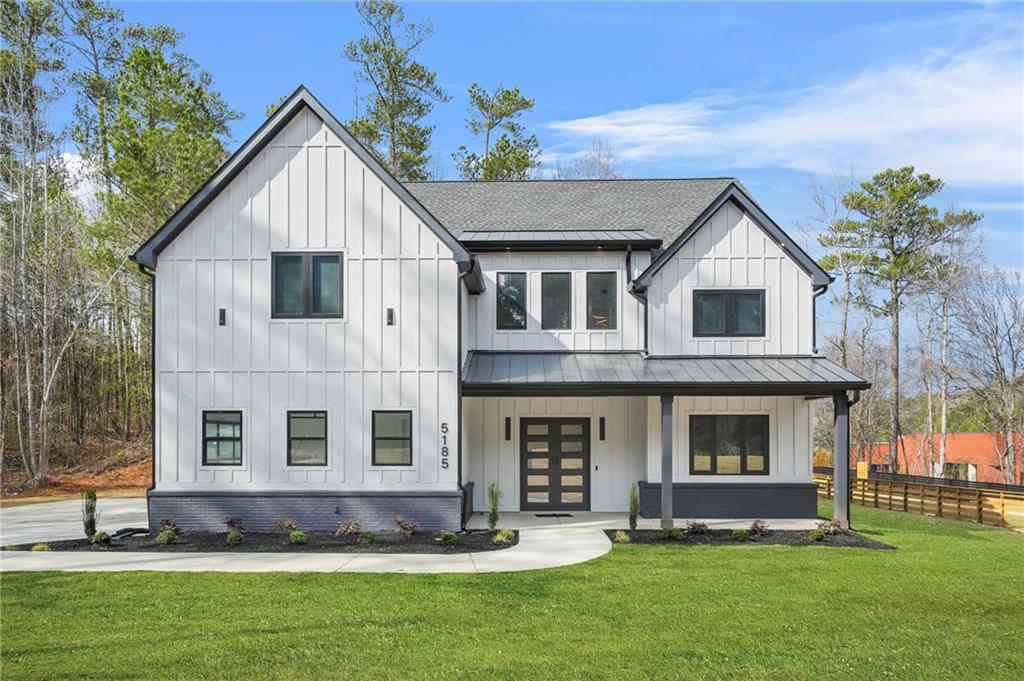 a view of house with yard