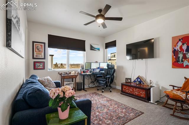 74 Sommerlyn Road Colorado Springs, CO 80906 - Photo 18 of 32 Office area with ceiling fan and light carpet