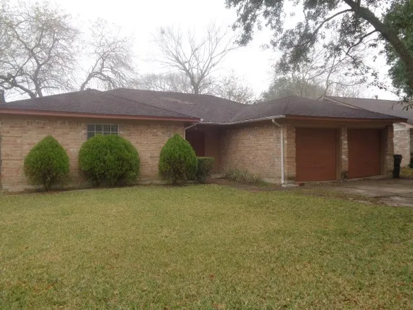 a house with trees in front of it