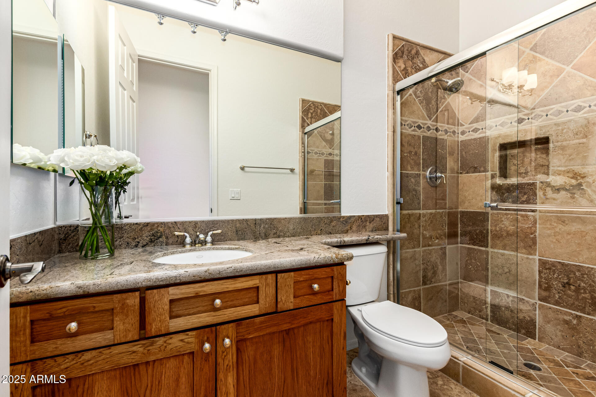 16030 South 27th Drive Phoenix, AZ 85045 - Photo 13 of 29 a bathroom with a granite countertop sink toilet and shower