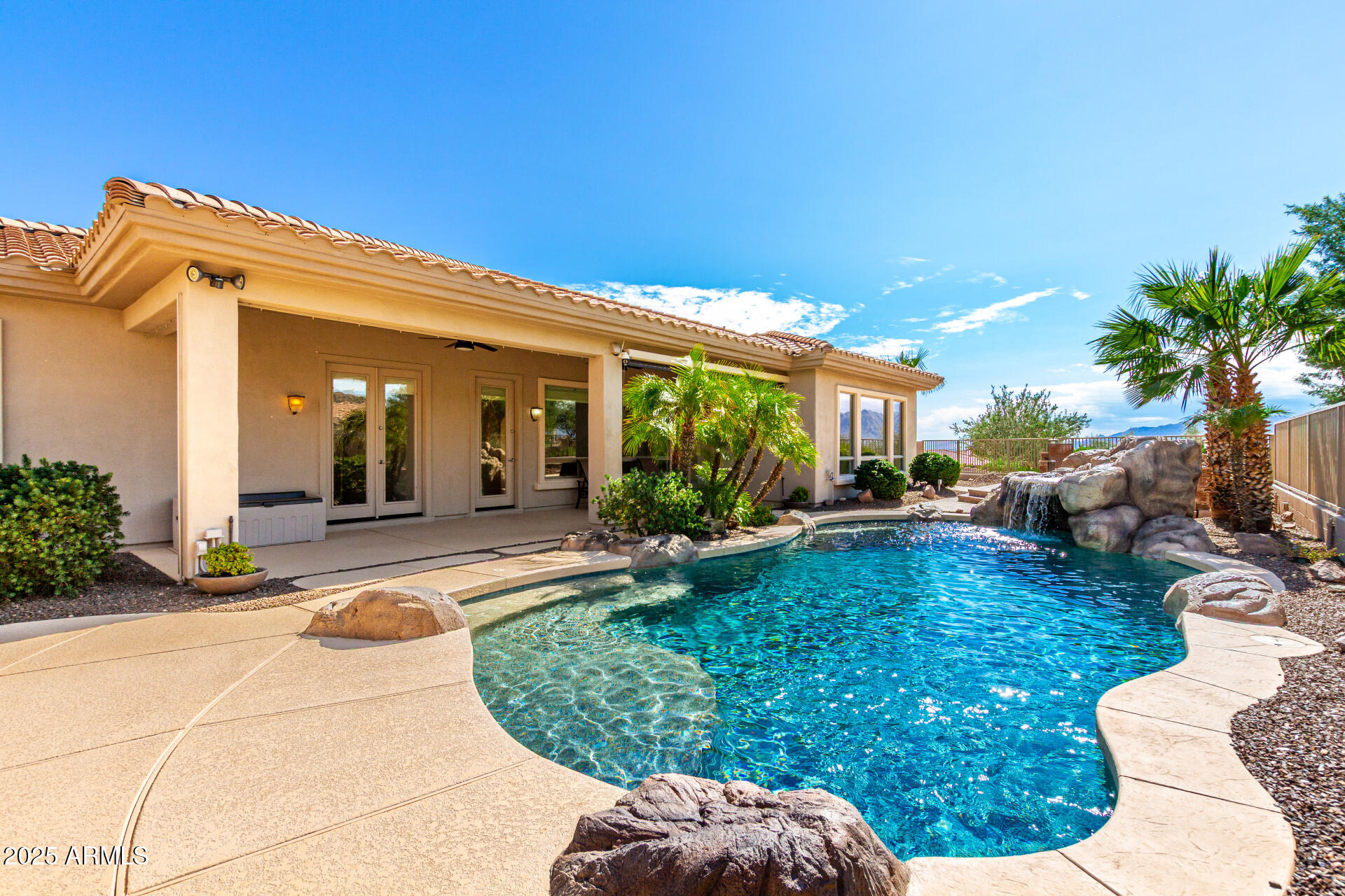 16030 South 27th Drive Phoenix, AZ 85045 - Photo 21 of 29 a view of a patio with table and chairs potted plants and a large tree