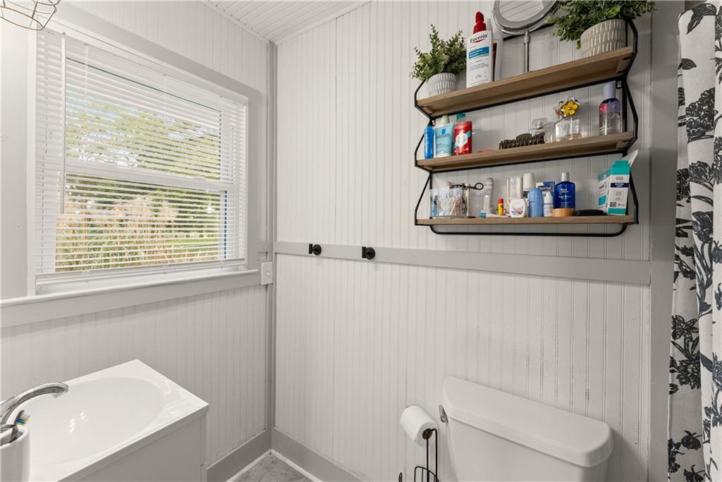5907 Main Street Lula, GA 30554 - Photo 25 of 60 a bathroom with a bathtub and a window