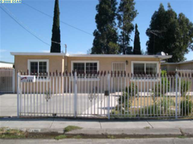 136 Peninsula Road Bay Point, CA 94565 - Photo 1 of 1 a view of a house with a small yard and wooden fence