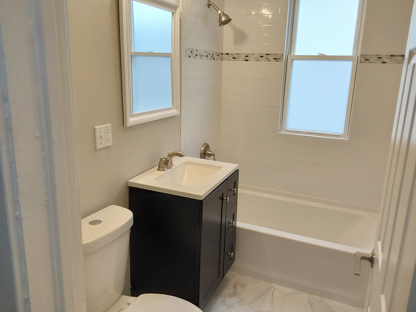 7712 South Evans Avenue Chicago, IL 60619 - Photo 10 of 22 a bathroom with a sink toilet and shower